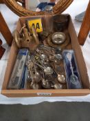 A tray of metalware including tourist spoons, brass cannon & AA badge etc.