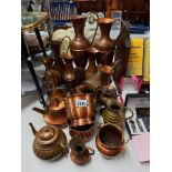 A good collection of vintage copper jugs etc including tea pots Collect only
