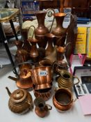 A good collection of vintage copper jugs etc including tea pots Collect only