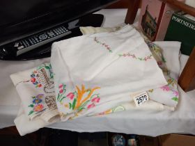 A quantity of vintage embroidered tablecloths