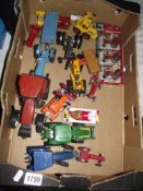 A box of diecast tractors including Ertl, Britains, Dinky, Corgi etc