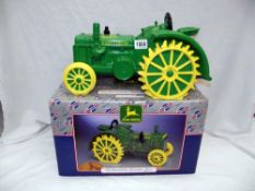 A boxed John Deere collectors cookie jar as a tractor