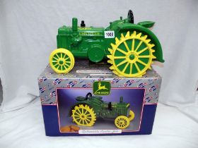 A boxed John Deere collectors cookie jar as a tractor