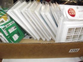 A large collection of dolls house windows and doors
