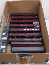 A quantity of maroon 'OO' gauge coaches and Western courier engine