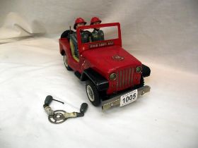 A vintage Nomura battery operated fire department Jeep, untested, base is loose