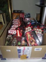 A box of Star Wars force awakens Rogue 1 and episode 1 figurines, still carded