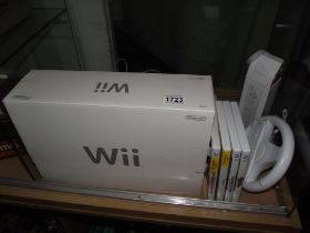 A boxed Wii console, accessories and games