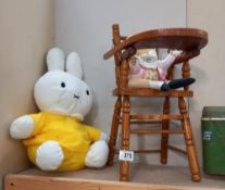 A dolls wooden high chair and 2 soft toys