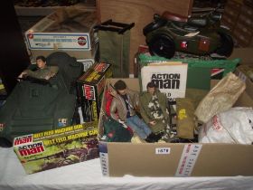 A vintage Action Man boxed belt feed machine gun and field radio pack and 2 dolls, clothing, tent
