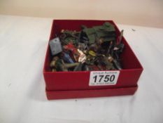 A quantity of vintage lead cowboys and Indians and pre-war Dinky