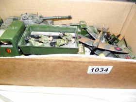 A Dinky tank transporter and other military vehicles and aircraft including Matchbox