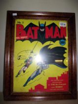 A framed retro metal sign of Batman no1 comic