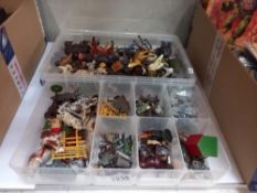 A good quantity of plastic zoo animals and lead farm animals and people in 2 trays