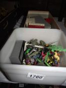 A box of early Lego and a tub of plastic soldiers