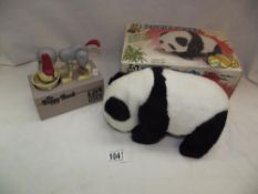 A boxed battery operated lovely Panda and a novelty dog money box