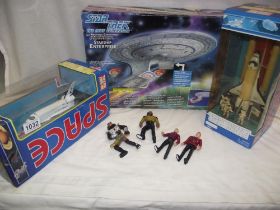 A boxed Star Trek the Next Generation Enterprise and 2 Realtoy space shuttles, all unchecked
