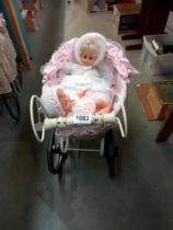 An antique style dolls pram and contents COLLECT ONLY