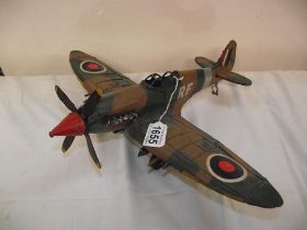 A retro pressed steel model of a Spitfire