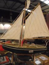 A wooden pond yacht on stand COLLECT ONLY