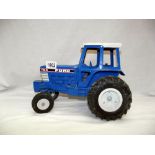 A large scale ERTL diecast Ford TW-5 tractor