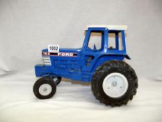 A large scale ERTL diecast Ford TW-5 tractor