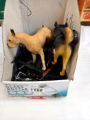 A large quantity of vintage Action men rifles and 2 dogs