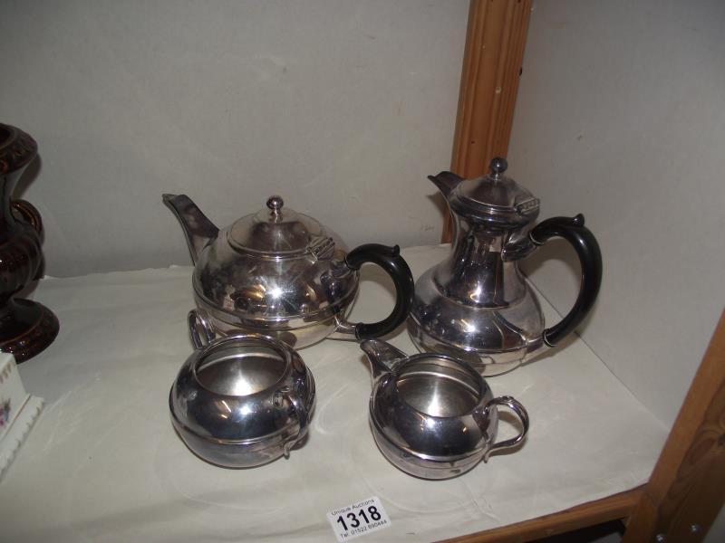 A 4 piece silver plate teaset (teapot, hot water jug, milk jug and sugar bowl)