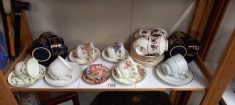 A quantity of cups and saucers including trios etc
