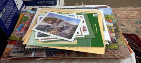 A selection of railway calendars plus completed and carded railway related jigsaw puzzles COLLECT