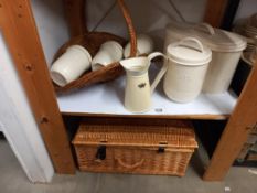 A wicker picnic basket, flower basket and a kitchen set of bread bin, tea, sugar, coffee & biscuit