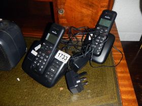 A pair of Binatone wireless telephones with charging docks.