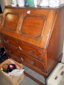 A Victorian oak two drawers bureau. COLLECT ONLY.