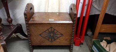 A hinged oak carved storage box/stool COLLECT ONLY