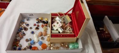 A jewellery box with contents and large lot of clip on earrings