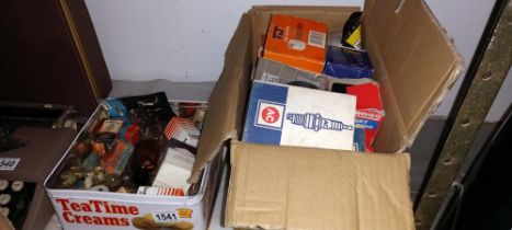 An old tin of car light bulbs & a box of vintage spark plugs and oil filters etc. COLLECT ONLY.