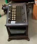 A large early Burroughs adding machine with beveled glass viewing panels COLLECT ONLY
