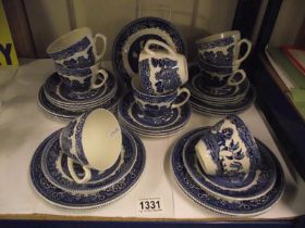 A Myott willow pattern blue and white tea set (11 plates, 11 saucers and 8 cups) COLLECT ONLY