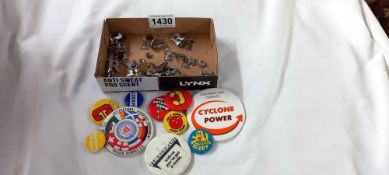 A mixed lot of badges including letters and numbers