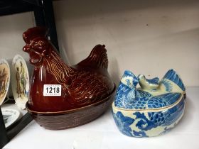 A large lidded chicken egg crock and a smaller blue and white example COLLECT ONLY