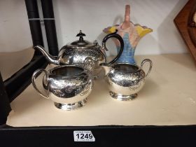 A 3 piece silver plate tea set (teapot, milk jug and sugar bowl) plus an Arthur Wood ceramic basket