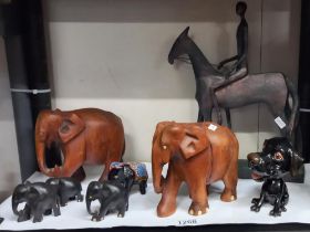 A quantity of elephants, china dog and an unusual horse and rider figure COLLECT ONLY