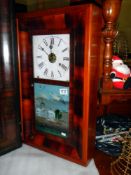 An American oak cased wall clock in working order, COLLECT ONLY.