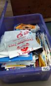 A large box of Carlisle United football programmes etc including football club carrier bags