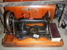A vintage cased Singer sewing machine, COLLECT ONLY.