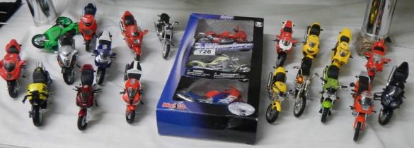 A good lot of boxed and loose model motor cycles.