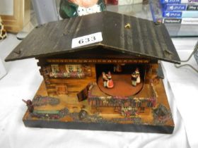 A vintage Swiss cottage musical box.