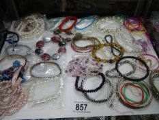 A good lot of bracelets etc.,