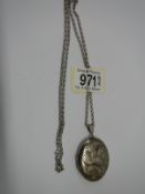 A silver locket on a silver chain.