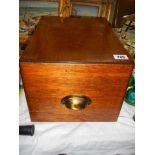 A vintage oak filing drawer.